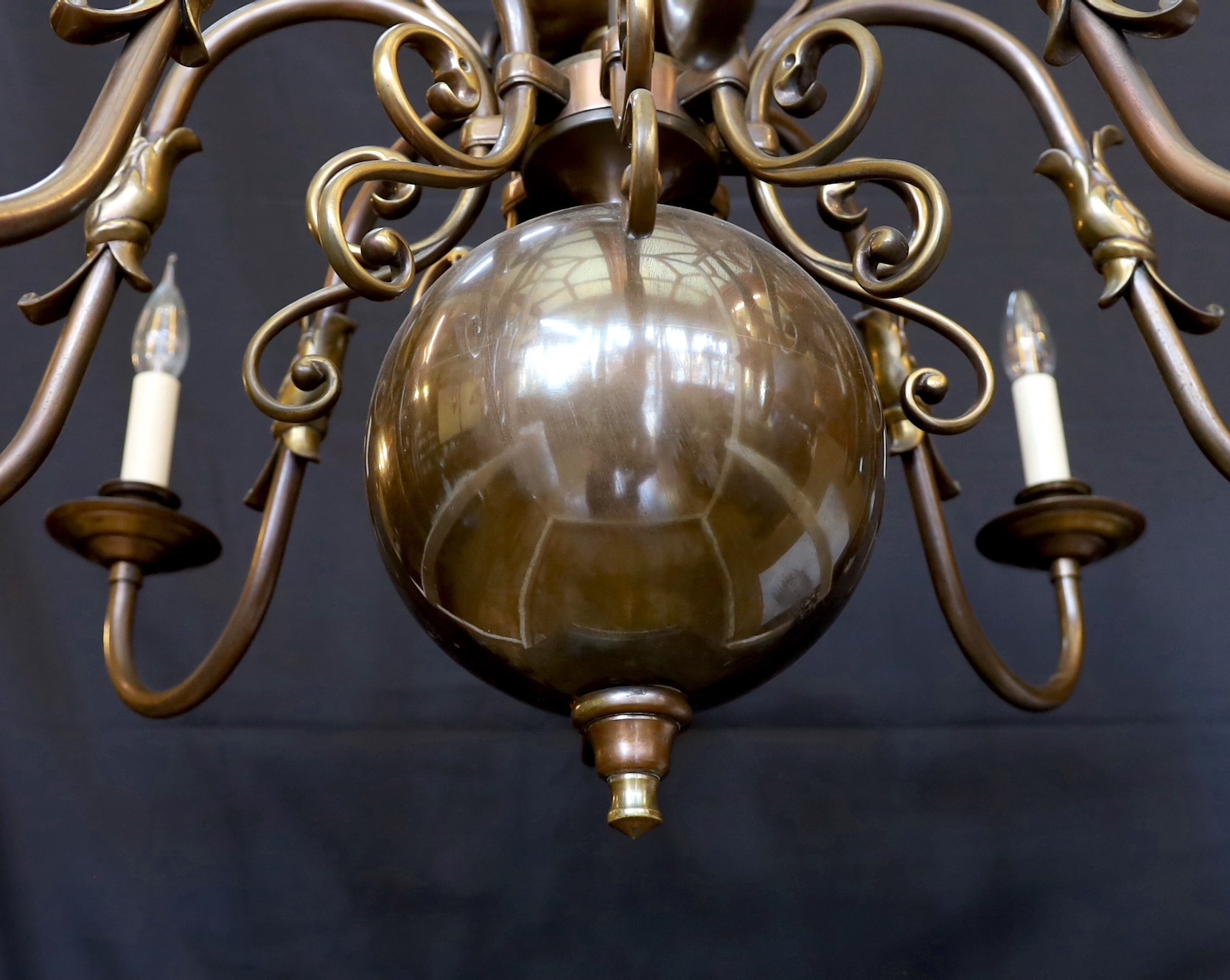 A large Dutch bronzed brass eight light chandelier, drop 70cm. width 86cm